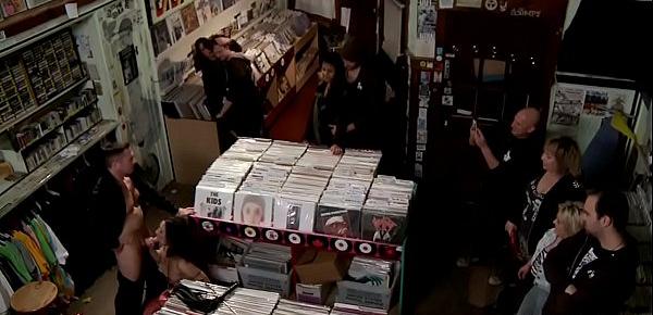  Brunette sucks cock in records shop